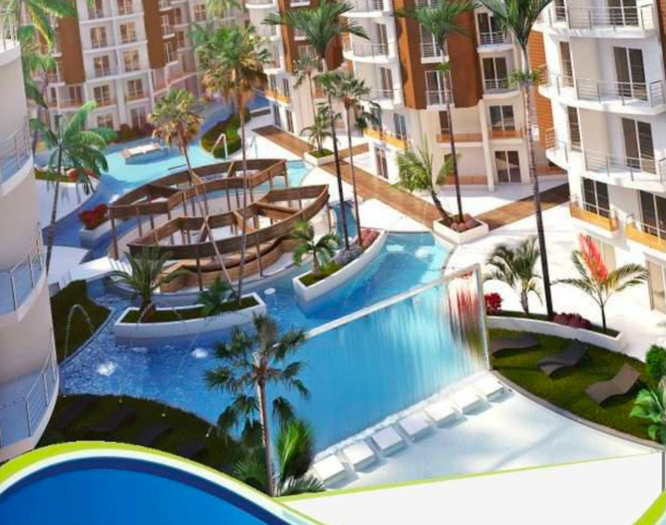 Brochure render — swim up bar in the heart of the resort, submerged bar stools, tropical planting, water jets