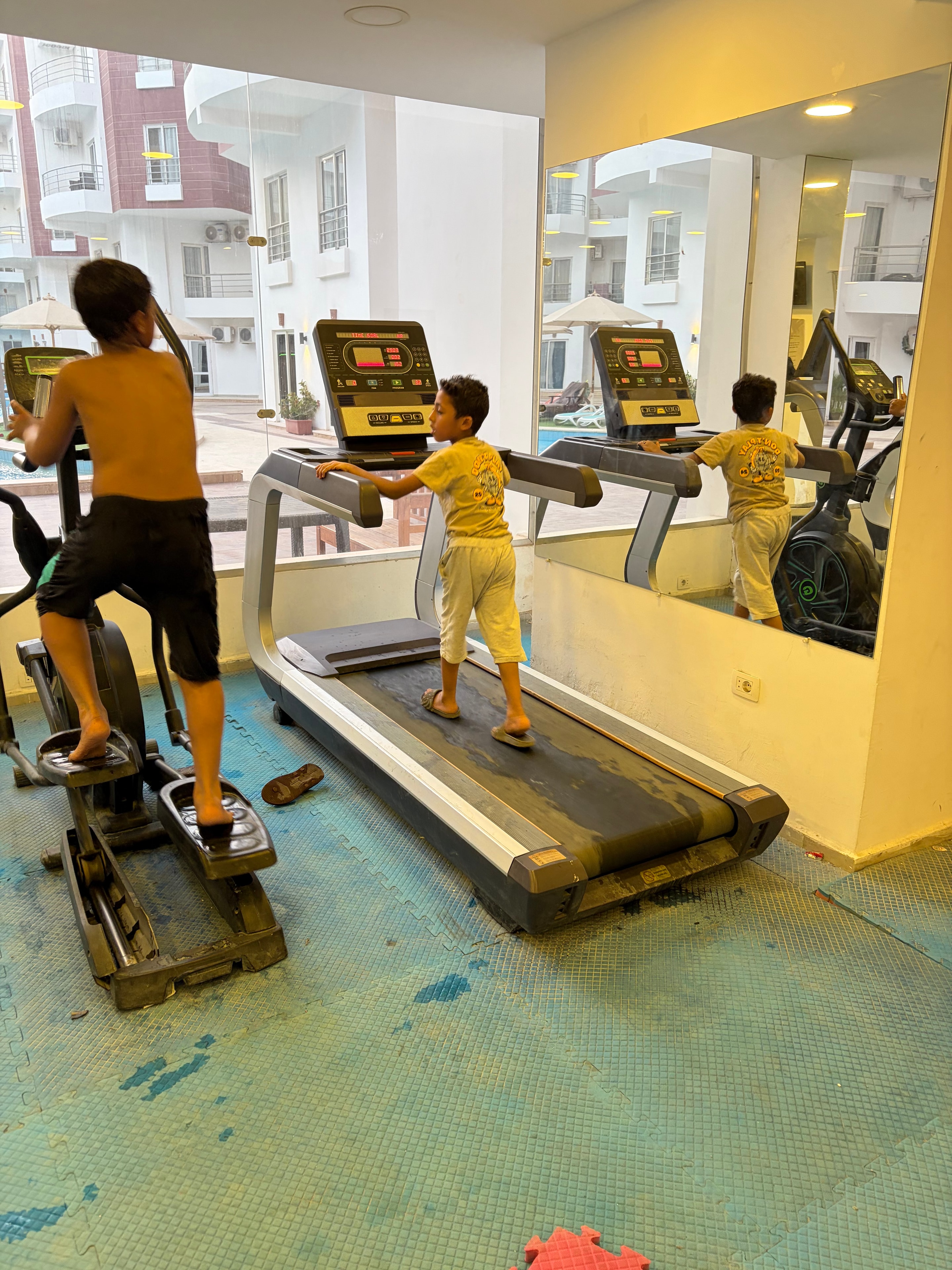 Gym jacuzzi area with heavy mould and algae on surround — completely unusable