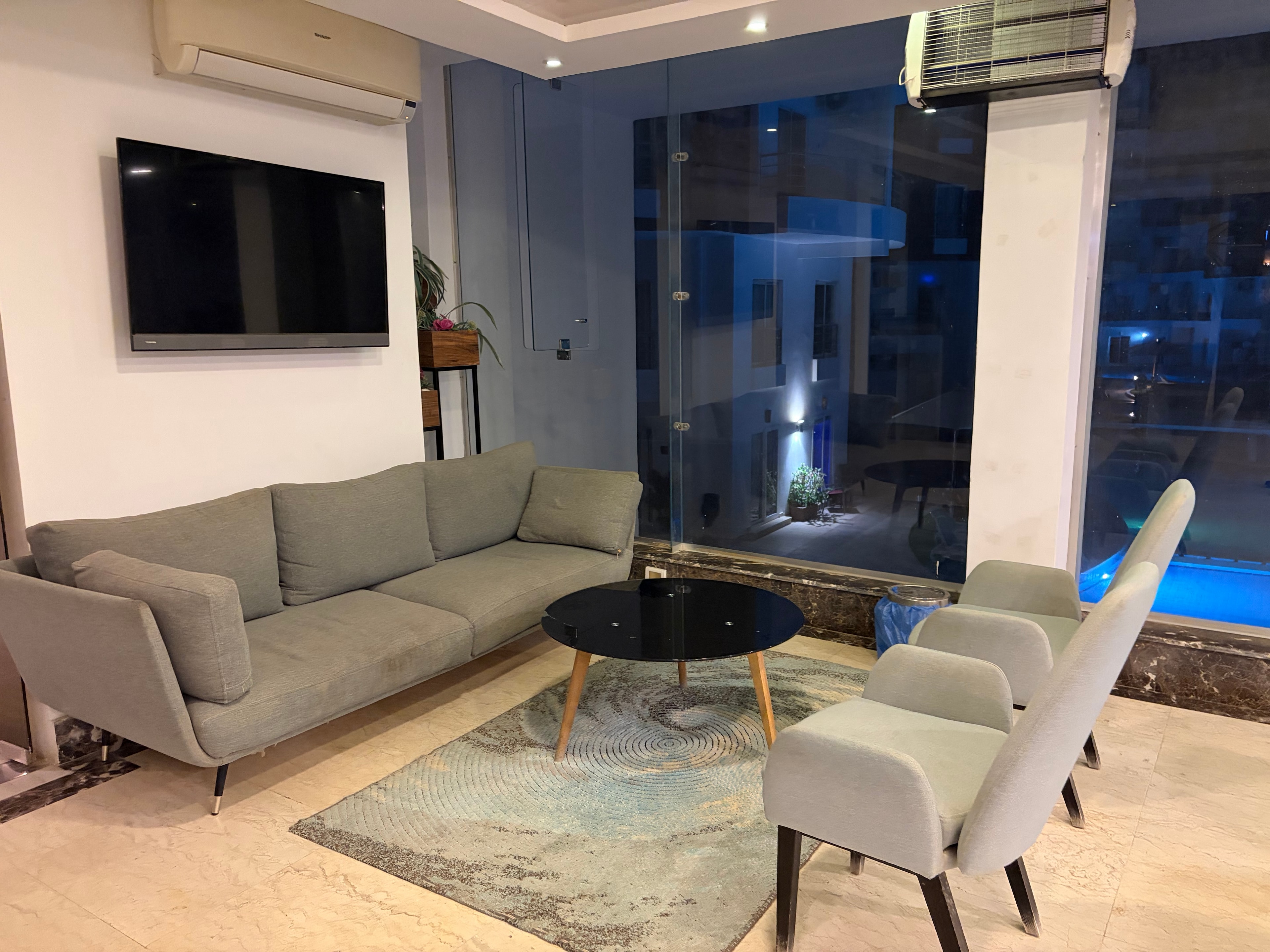 Lobby area with exposed wiring and unfinished surfaces